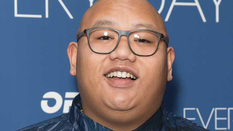 Jacob Batalon smiling on the red carpet