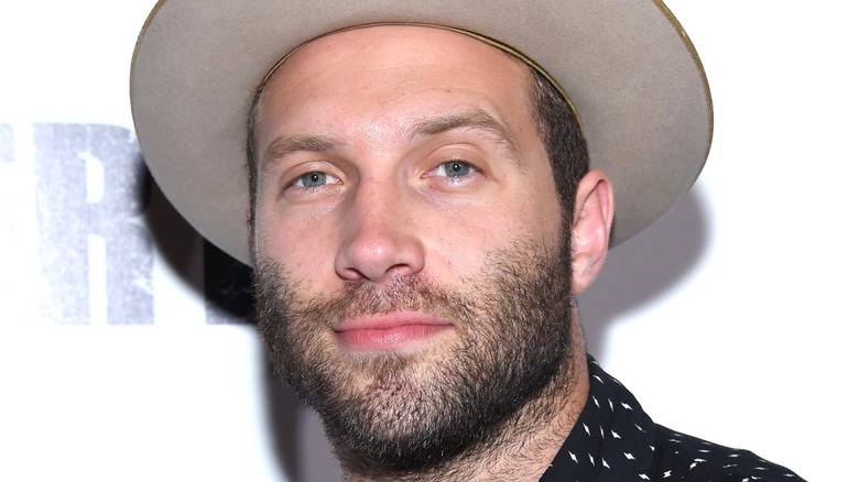 Jai Courtney with beard and hat