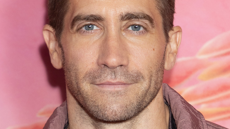 Jake Gyllenhaal smiling at Strange World premiere
