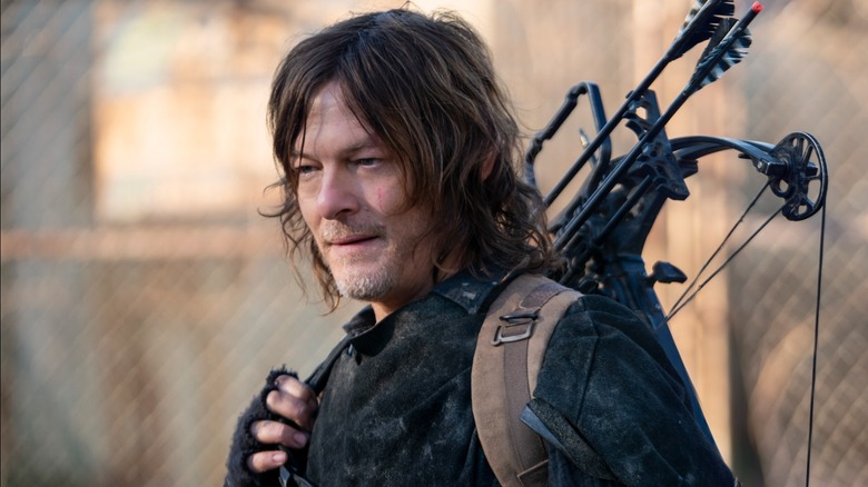 Daryl Dixon with crossbow over shoulder