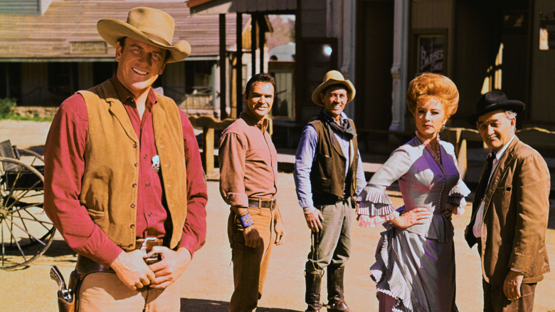 Gunsmoke's main players posing on western backlot