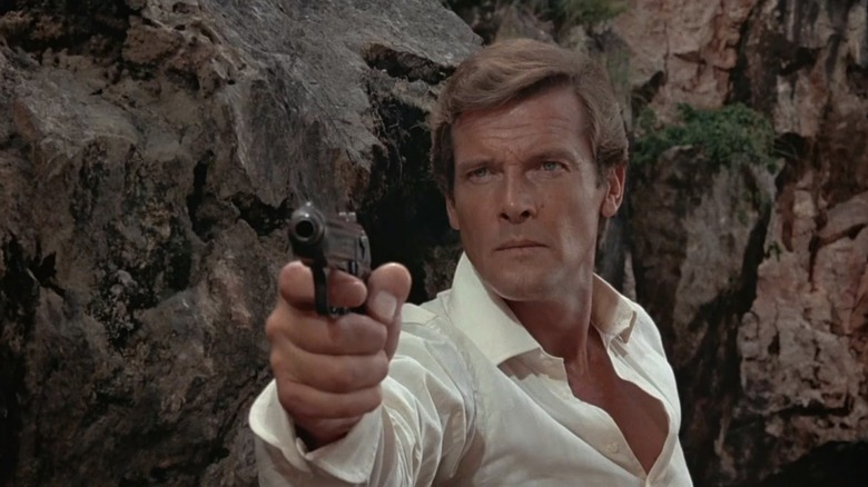 James Bond pointing a pistol in "The Man with the Golden Gun" (1974)