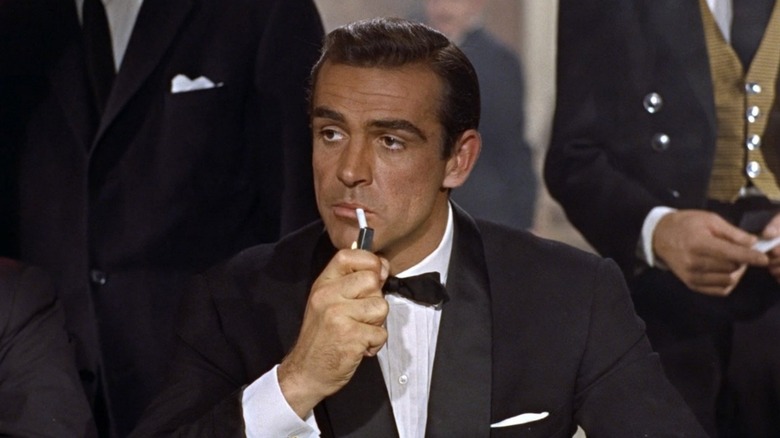James Bond lighting a cigarette in "Dr. No" (1962)