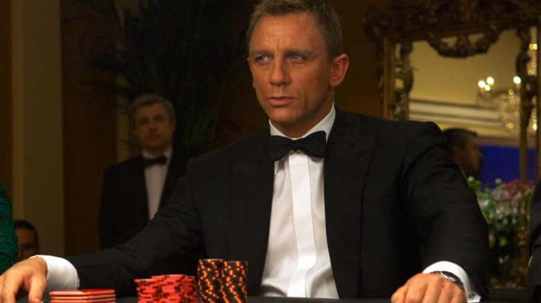Bond sits at a casino table in "Casino Royale" (2006)