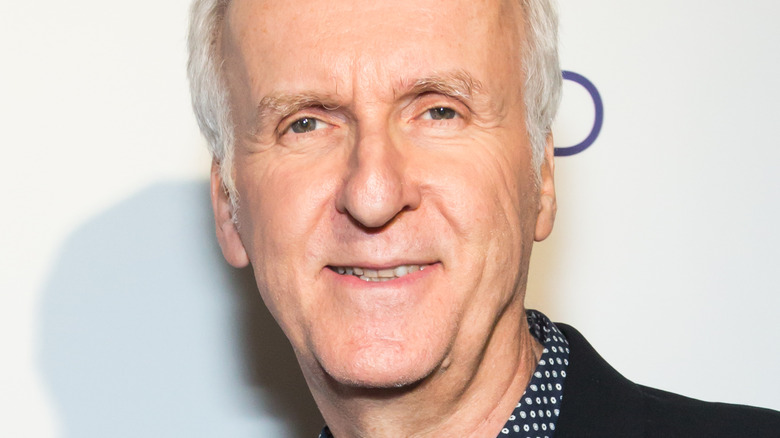 James Cameron smiling against a white background
