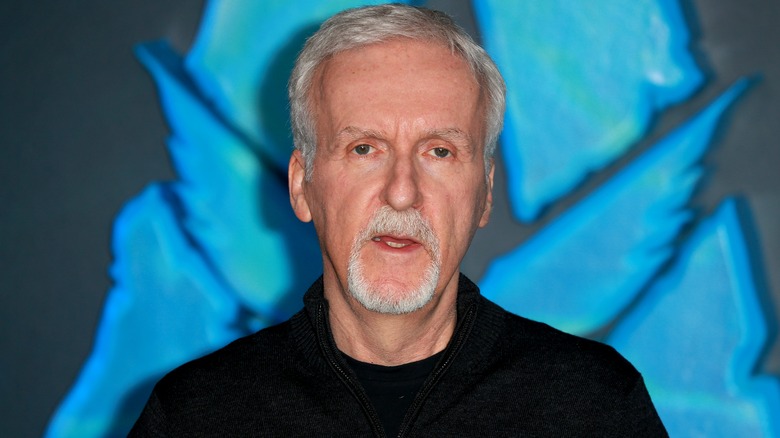 James Cameron posing on red carpet 