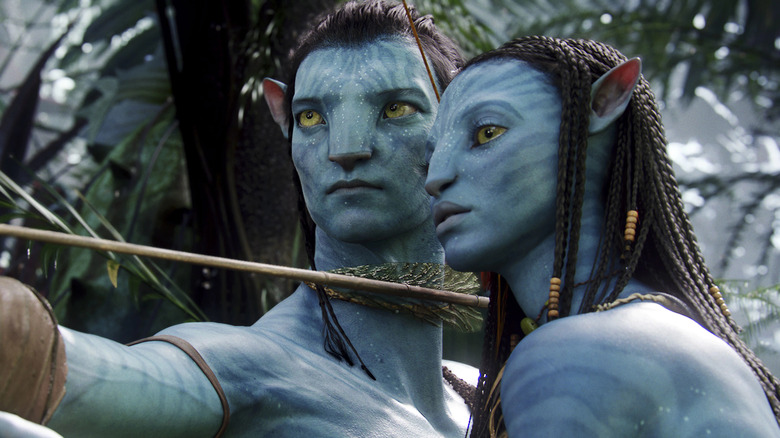 Neytiri and Jake shooting arrow in Avatar 