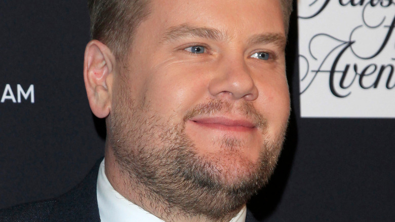 James Corden closed smile black background