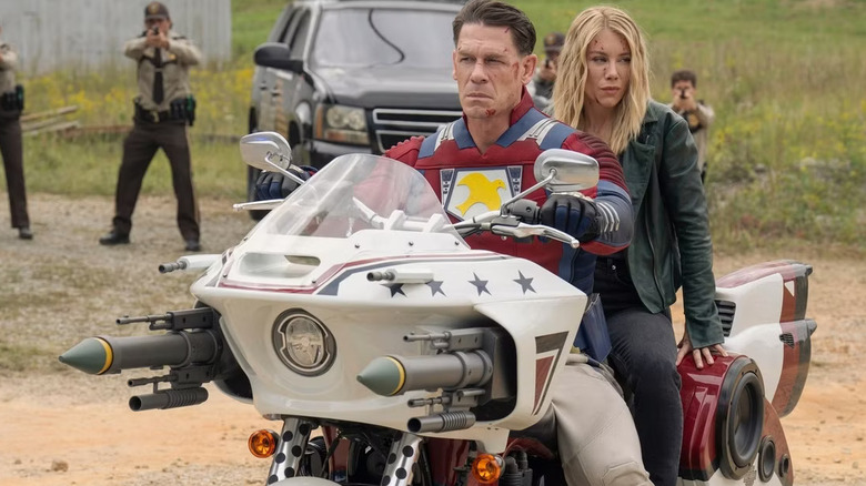 Peacemaker and Harcourt sitting on his motorcycle, cornered by police in a Nazi-infested alternate reality