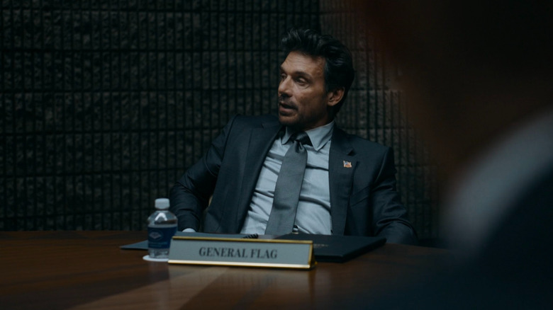 General Flag sitting in on a Pentagon meeting with Lex Luthor about his plans for Planet Watch.