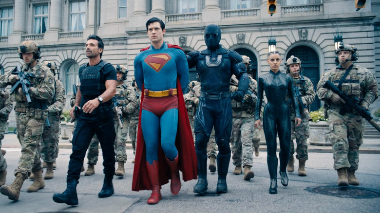 A group of U.S. soldiers, General Rick Flag, Ultra Man, and Engineer arresting Superman