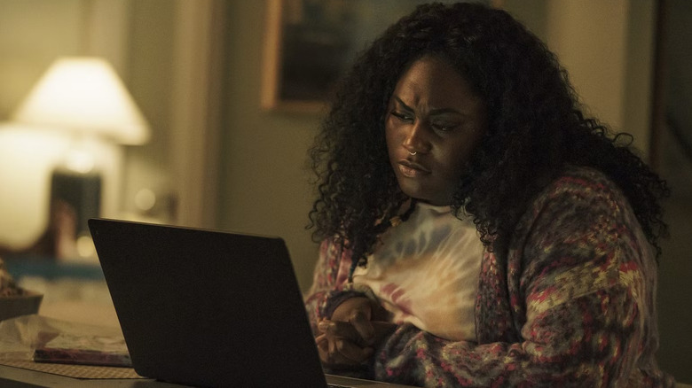 Naturally talented special agent Leota Adebayo scrolling on her laptop