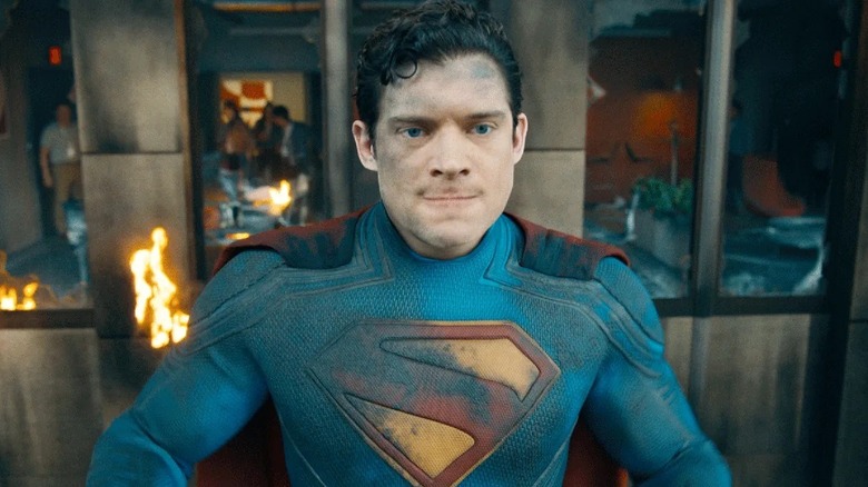 Superman standing in front of a burning building (2025)