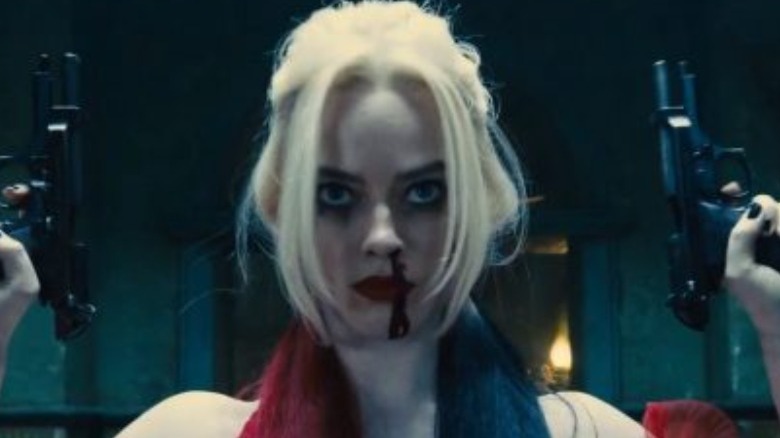 Harley Quinn holding guns