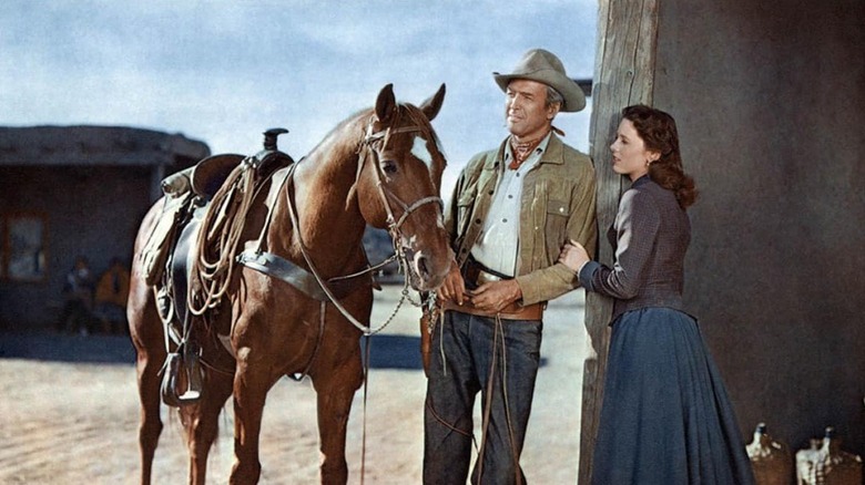 Will Lockhart resting next to a horse in "The Man from Laramie" (1955)