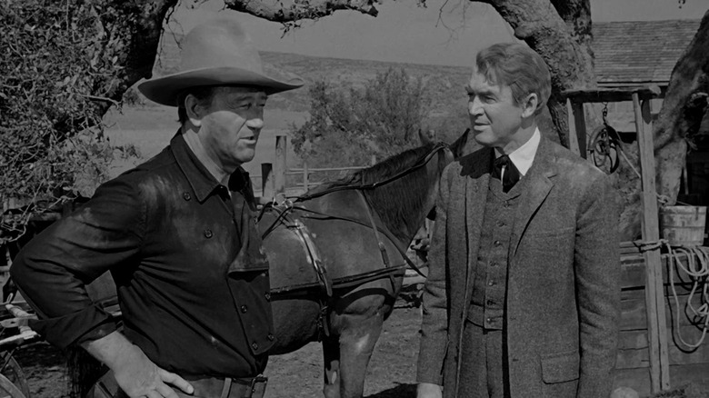 Tom Doniphon and  Ransom "Ranse" Stoddard chatting in "The Man Who Shot Liberty Valance" (1962)