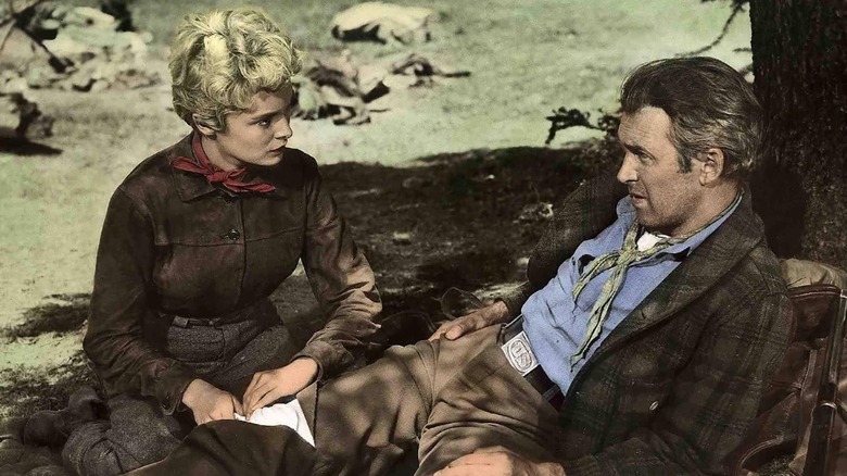 Lina Patch tending to a wound on Howard Kemp in "The Naked Spur" (1953)