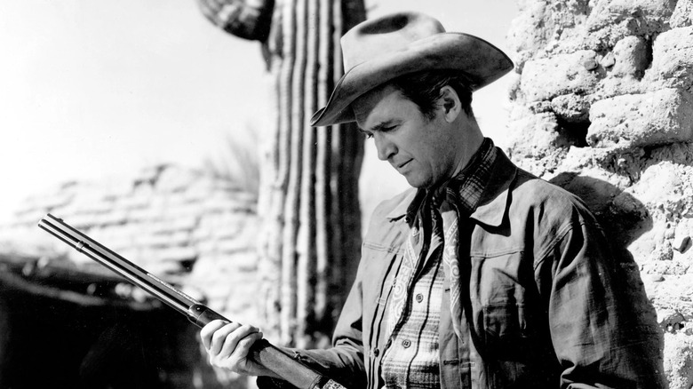 Lin McAdam looking over his weapon in "Winchester '73" (1950)
