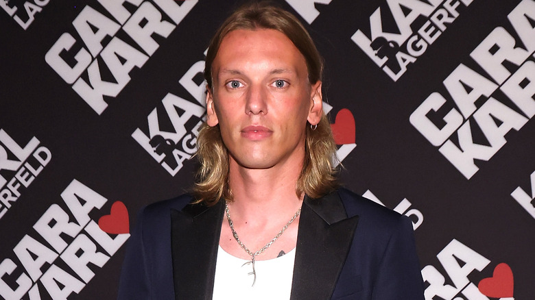 Jamie Campbell Bower staring ahead