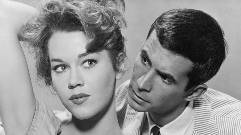 Jane Fonda scratches the back of her head