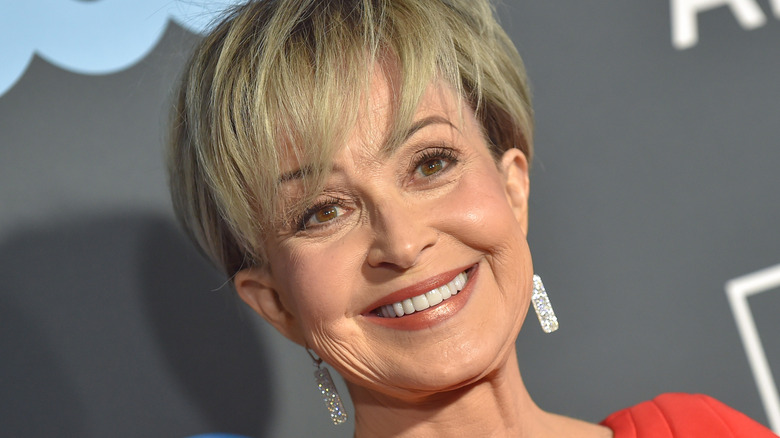 Annie Potts smiling on red carpet