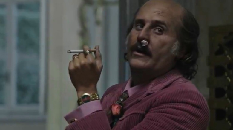 Paolo Gucci smoking a cigarette