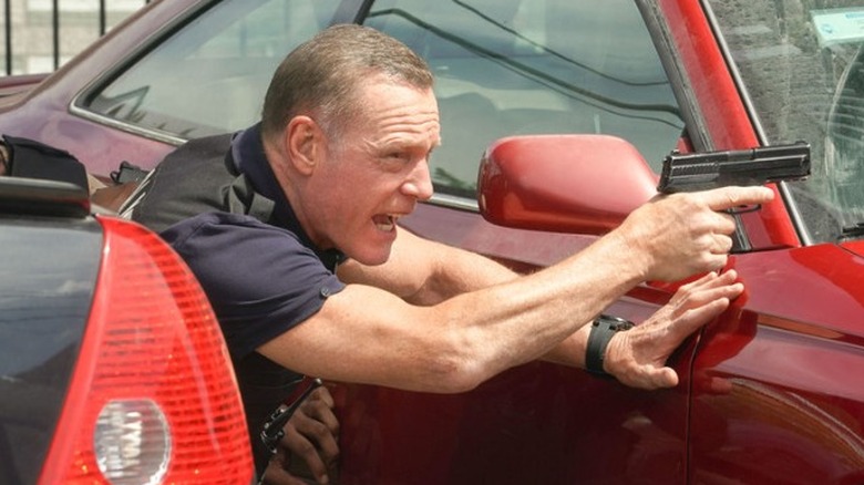 Jason Beghe aiming gun