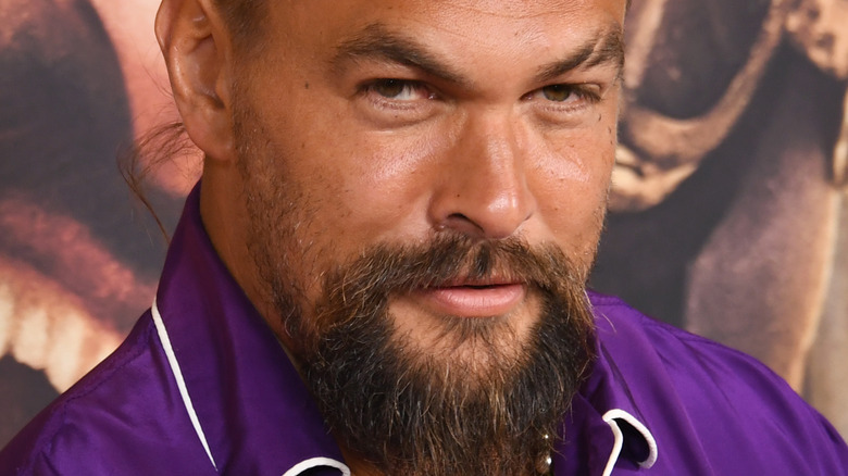 Jason Mamoa smirking