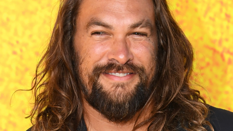 Jason Momoa smiling at red carpet premiere