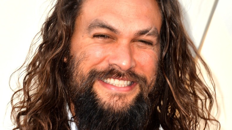 Jason Momoa smiling at premiere