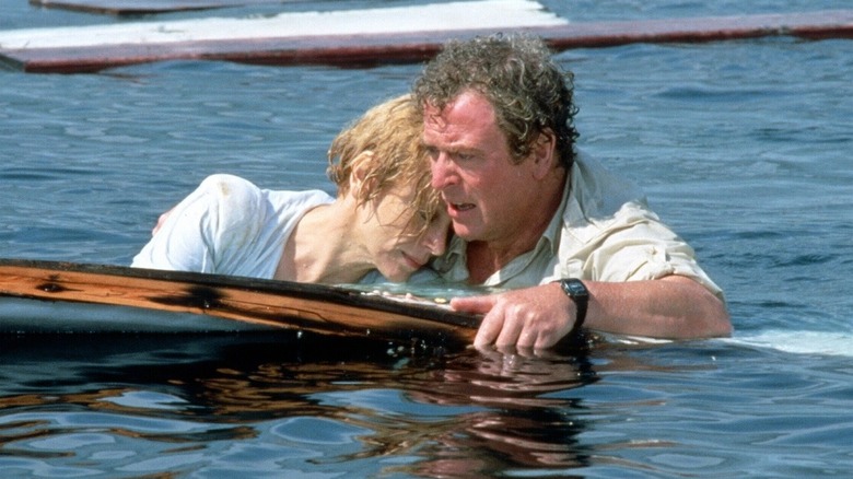 Michael Caine and Lorraine Gary floating in water