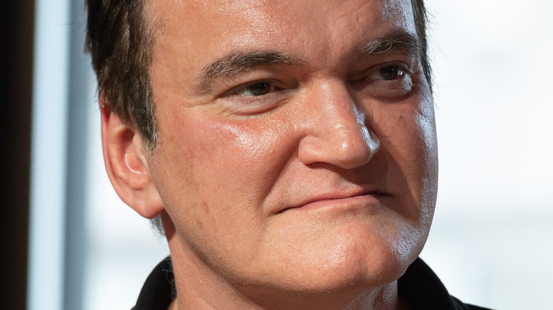 Quentin Tarantino smiling in an interview