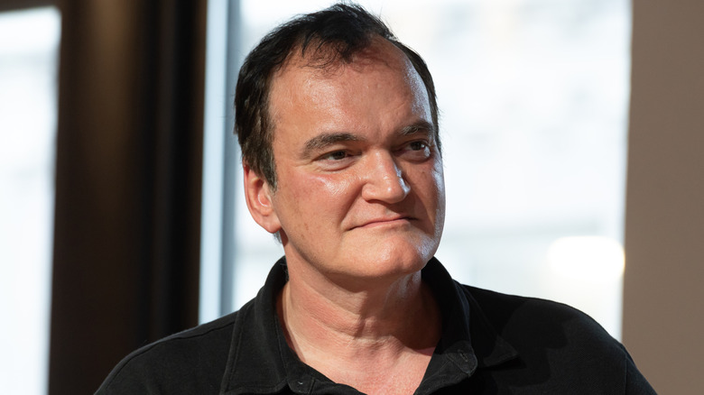 Quentin Tarantino smiling in an interview