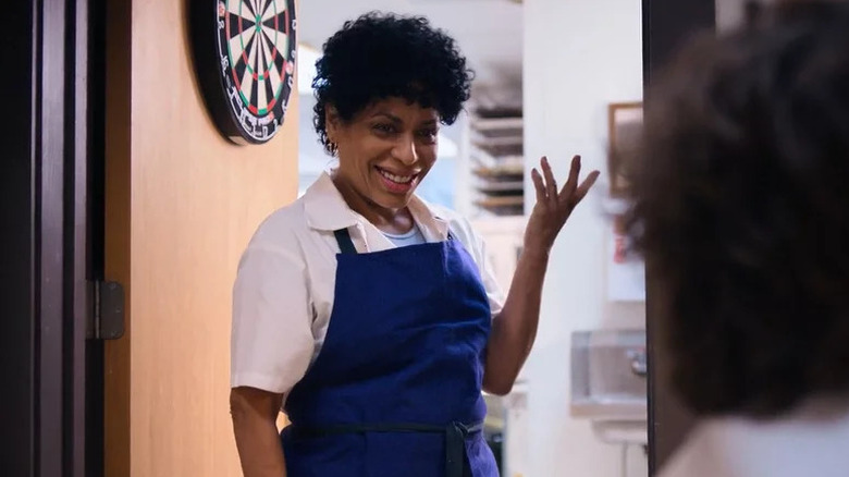 Tina Marrero smiling in front of an open door on The Bear