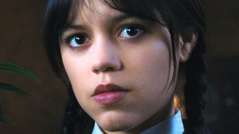 Jenna Ortega acting as Wednesday Addams