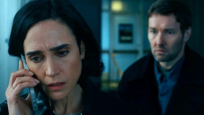 Daniela Dessen on the phone while Jason Dessen watches on in Dark Matter