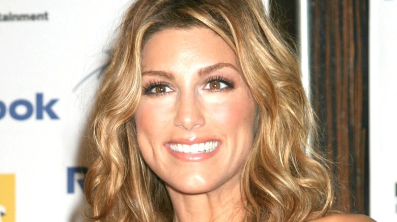 Jennifer Esposito stops and gets her picture taken