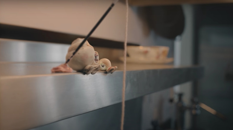 Marcel the Shell and Nana Connie sitting on ledge