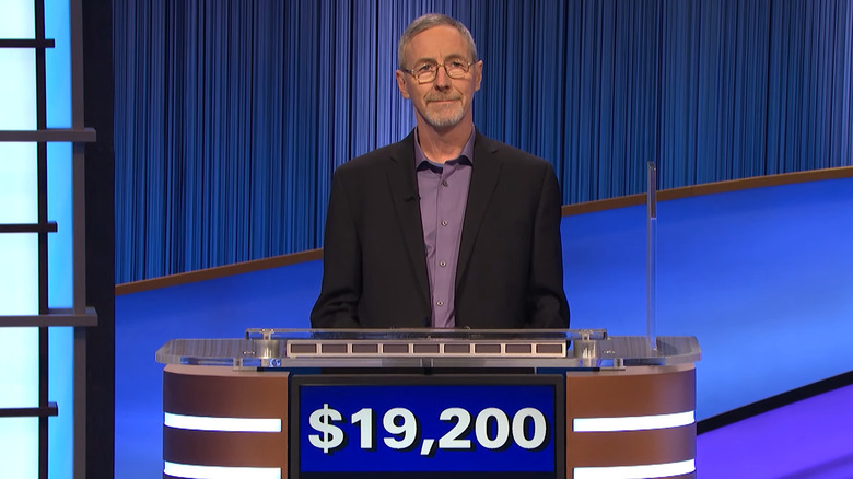Ray Lalonde stands at his Jeopardy podium