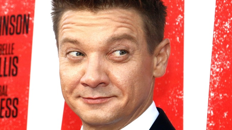 Jeremy Renner smirking