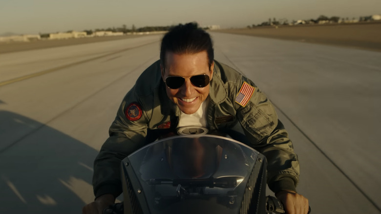 Tom Cruise speeding away on a motorcycle