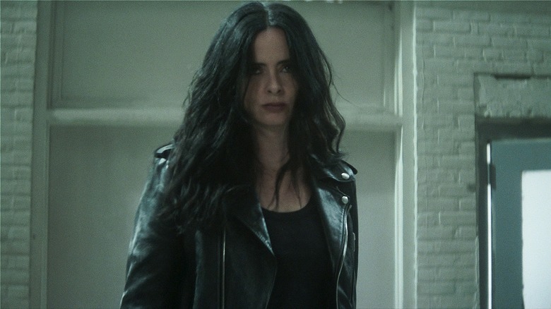 Jessica Jones standing with hair in her face in Daredevil: Born Again
