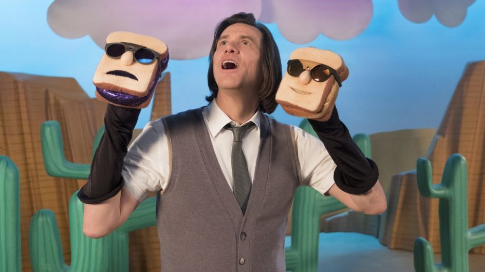 Jim Carrey  as Mr. Pickles with sandwich hand puppets in Kidding