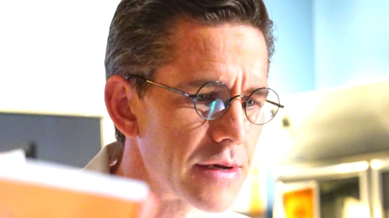 Brian Dietzen studying something