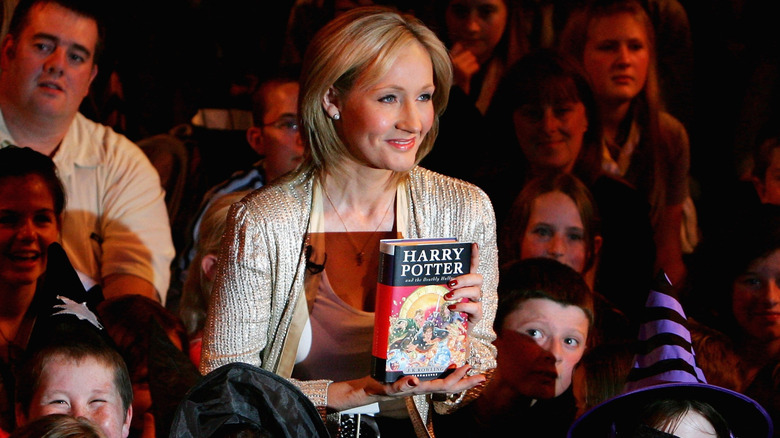 JK Rowling holding book