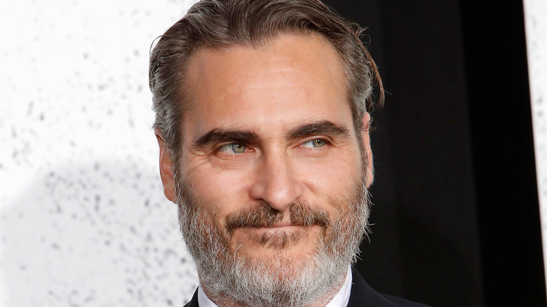 Joaquin Phoenix smiling at film premiere