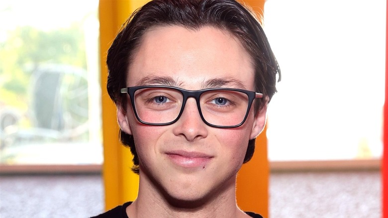 Reid Miller smiling glasses