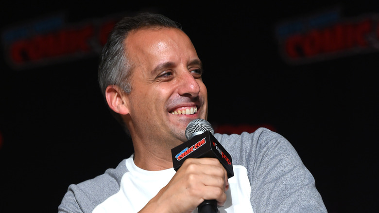 Joe Gatto holding microphone smiling