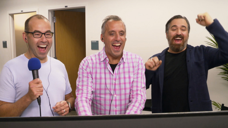 Murr, Joe, & Q laughing behind monitor