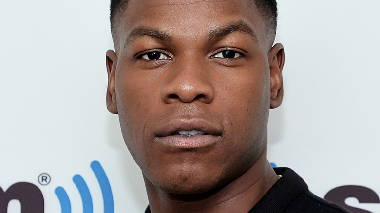 John Boyega smirking